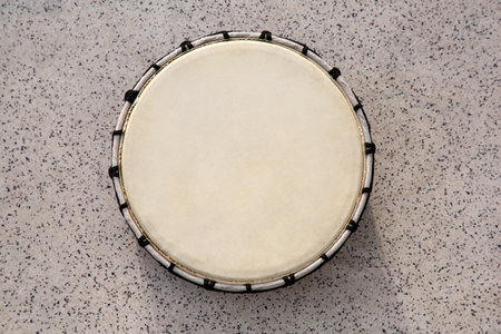 Drum on gray table, top view. Percussion musical instrumentの写真素材