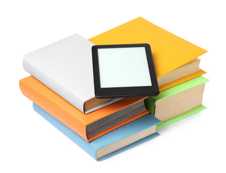 Modern e-book and stack of hardcover books isolated on whiteの写真素材