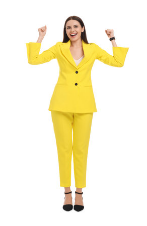 Beautiful businesswoman in yellow suit on white backgroundの写真素材