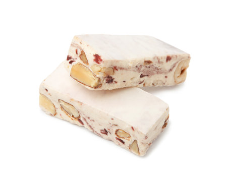 Pieces of delicious nougat on white backgroundの写真素材