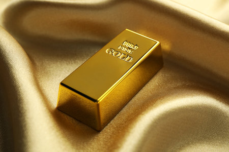 Gold bar on shiny silk fabric, closeupの写真素材