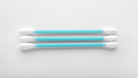 Clean cotton buds on white background, top view. Hygienic accessory