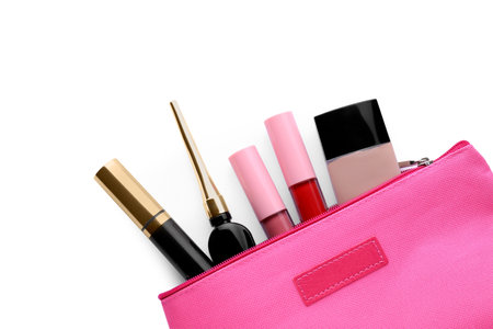 Black eyeliner and other makeup products in cosmetic bag on white background, top viewの写真素材