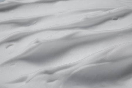 Texture of white shaving foam as background, top viewの写真素材