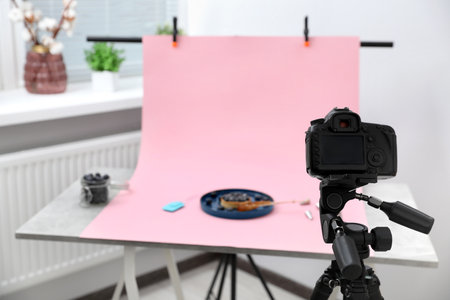 Professional equipment and composition with delicious dessert on pink background in studio. food photographyの写真素材