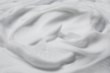 Texture of white shaving foam as background, closeupの写真素材