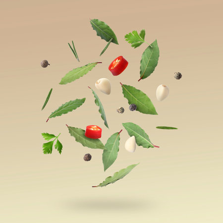 Bay leaves, rosemary, parsley, garlic cloves, black and fresh red hot peppers falling on beige gradient backgroundの写真素材