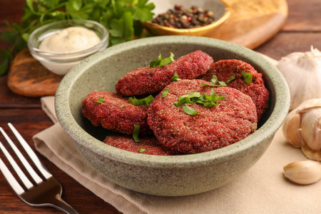 Tasty vegan cutlets served on wooden table, closeupの写真素材