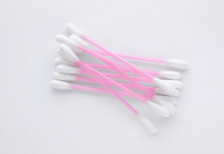Clean cotton buds isolated on white, top view
