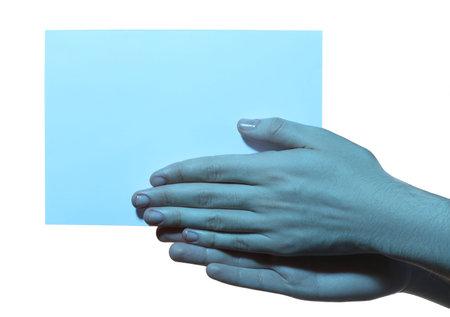 Man holding sheet of paper on white background, closeup and space for text. Color tone effectの写真素材