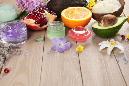 Homemade cosmetic products and fresh ingredients on wooden table, space for text. DIY beauty recipeの写真素材