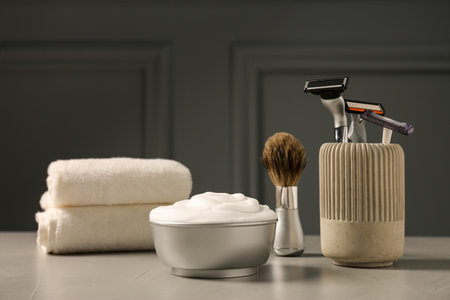 Set of men's shaving tools on gray tableの写真素材