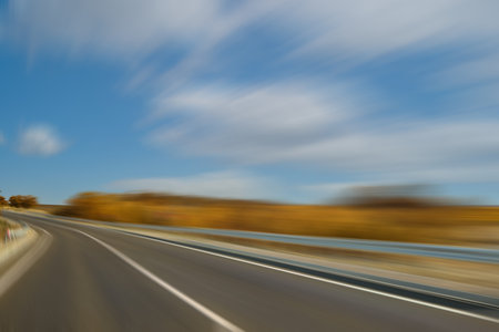 Asphalt country road without transport, motion blur effect