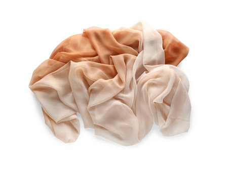 Beautiful beige tulle fabric on white background, top viewの写真素材