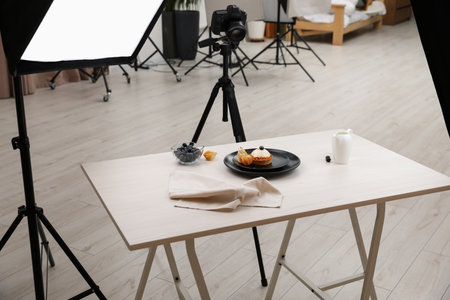 Professional equipment and composition with delicious dessert on wooden table in studio. Food photographyの写真素材