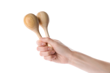 Woman holding wooden maracas on white background, closeup. Musical instrumentの写真素材