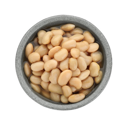 Bowl of canned kidney beans on white background, top view