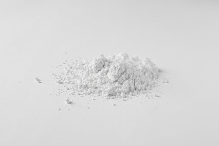 Heap of calcium carbonate powder on white backgroundの写真素材