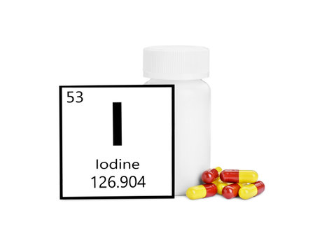 Card with iodine element, jar and pills isolated on white