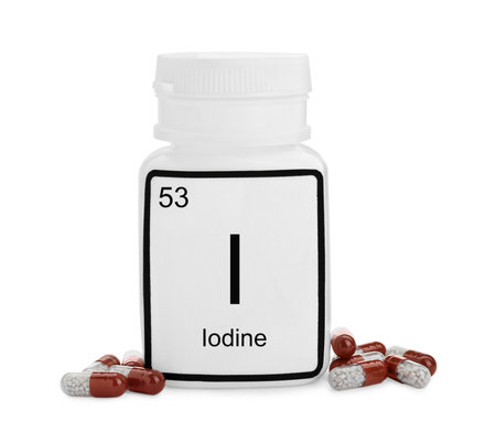 Plastic jar and iodine pills isolated on white