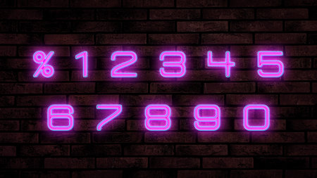Glowing neon number and percent signs on brick wallの写真素材