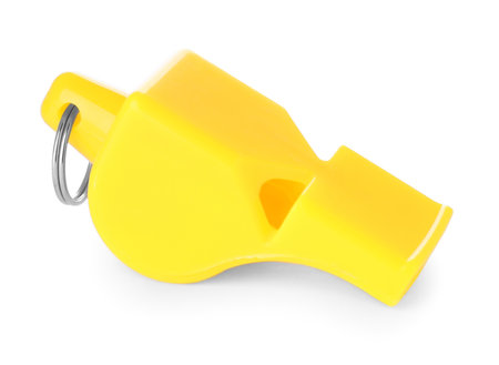 One yellow plastic whistle isolated on whiteの写真素材