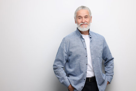 Portrait of handsome senior man on white background. Space for textの写真素材