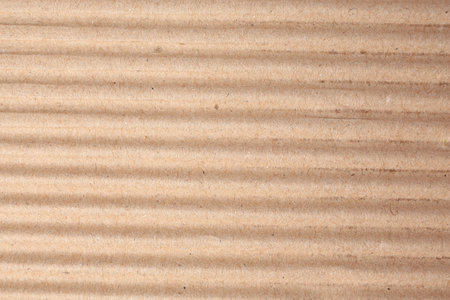 Texture of beige corrugated paper sheet as background, closeupの写真素材