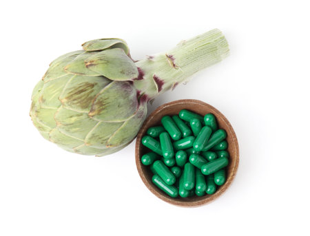 Fresh artichoke and pills isolated on white, top viewの写真素材