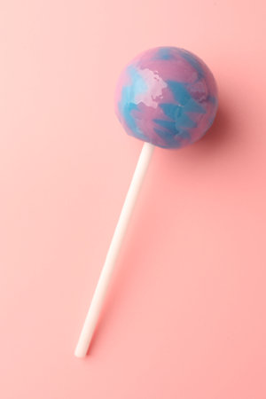 Tasty lollipop on pink background, top viewの写真素材