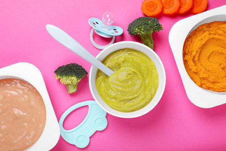 Flat lay composition with healthy baby food on pink backgroundの写真素材