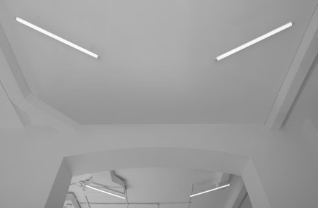 White ceiling with modern lighting in room, low angle view