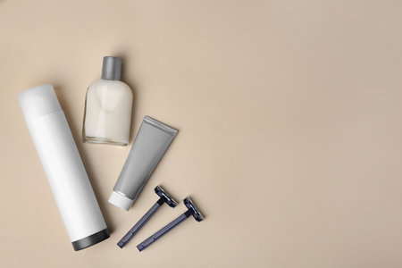 Flat lay composition with shaving accessories for men on beige background. Space for textの写真素材
