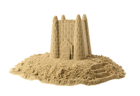 Pile of sand with beautiful castle isolated on white. Outdoor playの写真素材