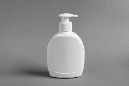 Bottle with cosmetic product on gray backgroundの写真素材