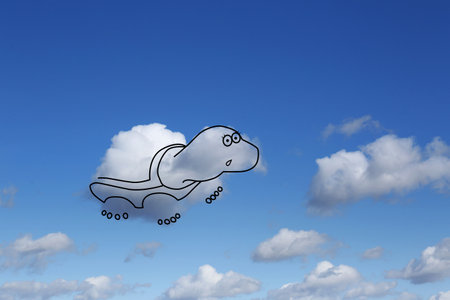 Imagination and creativity. Fluffy cloud in shape of turtle with drawn outline in blue skyの写真素材