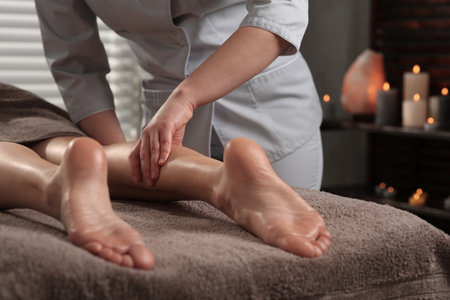 Woman receiving leg massage in spa salon, closeupの写真素材