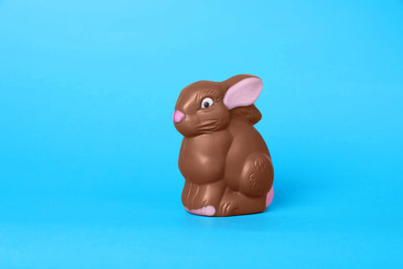 Chocolate bunny on light blue background. easter celebration