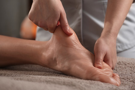 Woman receiving foot massage in spa salon, closeupの写真素材