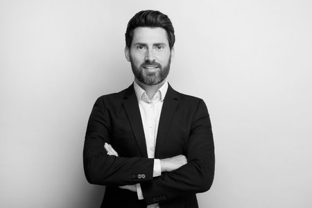 Portrait of handsome man on light background. Black and white effect