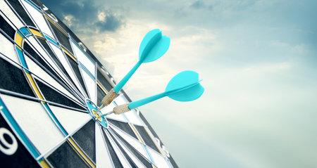 Dart board with light blue arrows hitting target against sky, space for text. Banner design