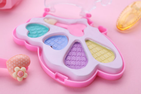 Decorative cosmetics for kids. Eye shadow palette on pink background, closeupの写真素材