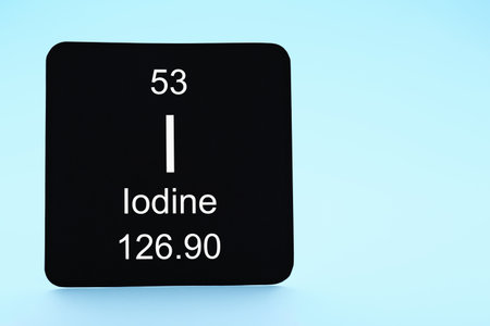 Card with iodine element on light blue background. Space for textの写真素材
