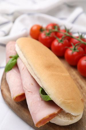 Delicious sandwich with ham and basil on table, closeupの写真素材