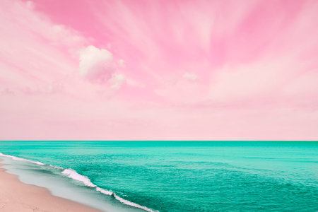 Fantastic pink sky over turquoise ocean and sandy beachの写真素材