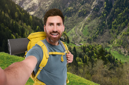 Happy tourist with backpack taking selfie in mountainsの写真素材
