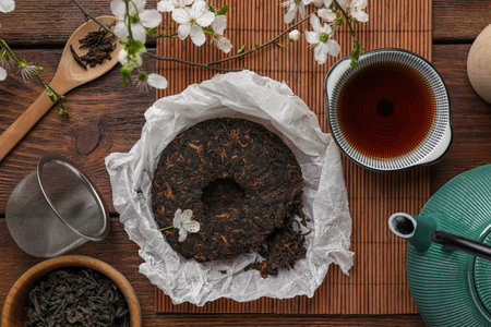 Flat lay composition with aromatic pu-erh tea on wooden tableの写真素材