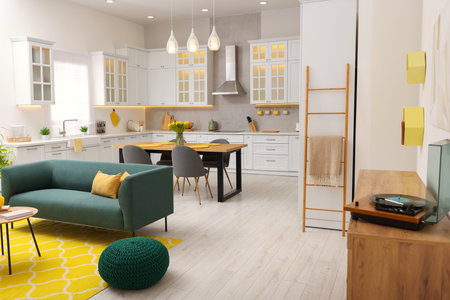 Spring atmosphere. Stylish kitchen interior with comfortable furniture and bouquet of beautiful...