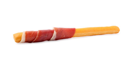 Delicious grissini stick with prosciutto isolated on whiteの写真素材