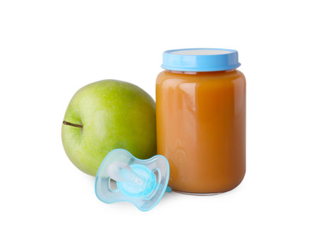 Healthy baby food, apple and pacifier on light gray backgroundの写真素材